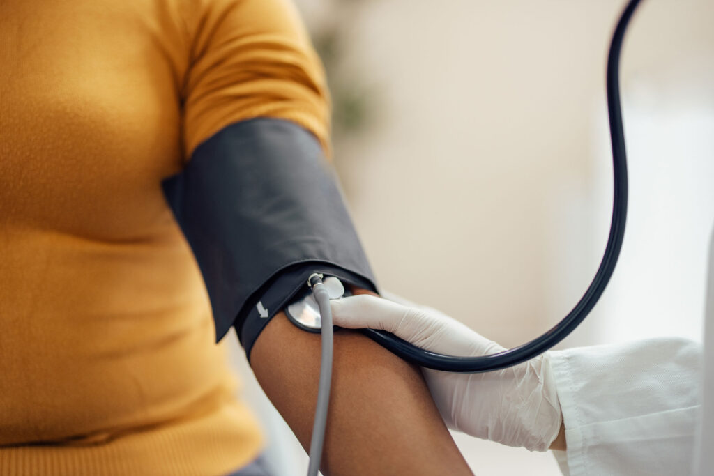 a person measuring blood pressure