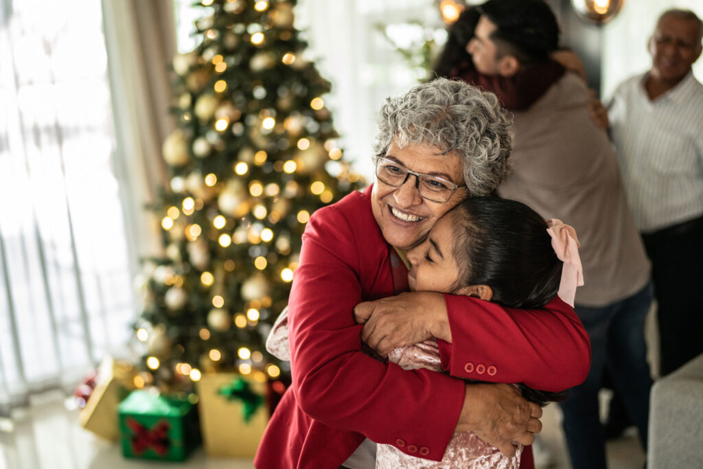 a woman hugging a girl