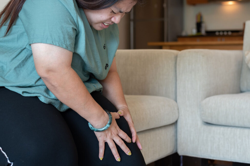 a woman holding her knee