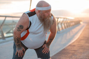 a man with a beard and a white headband