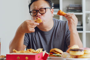 a man eating food at a table