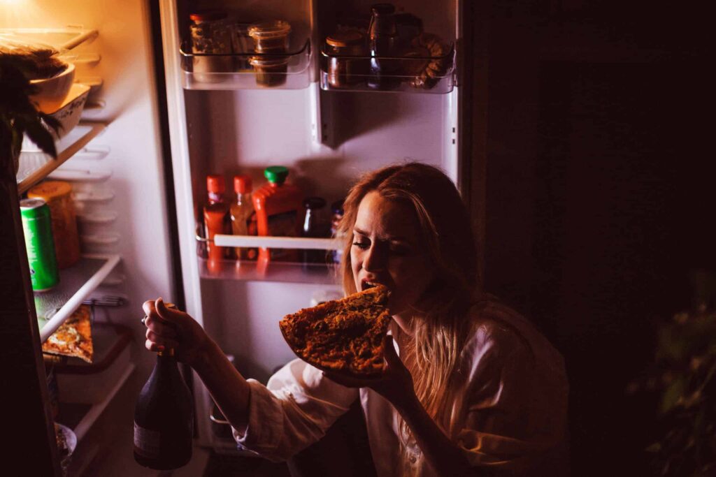 lady eating pizza