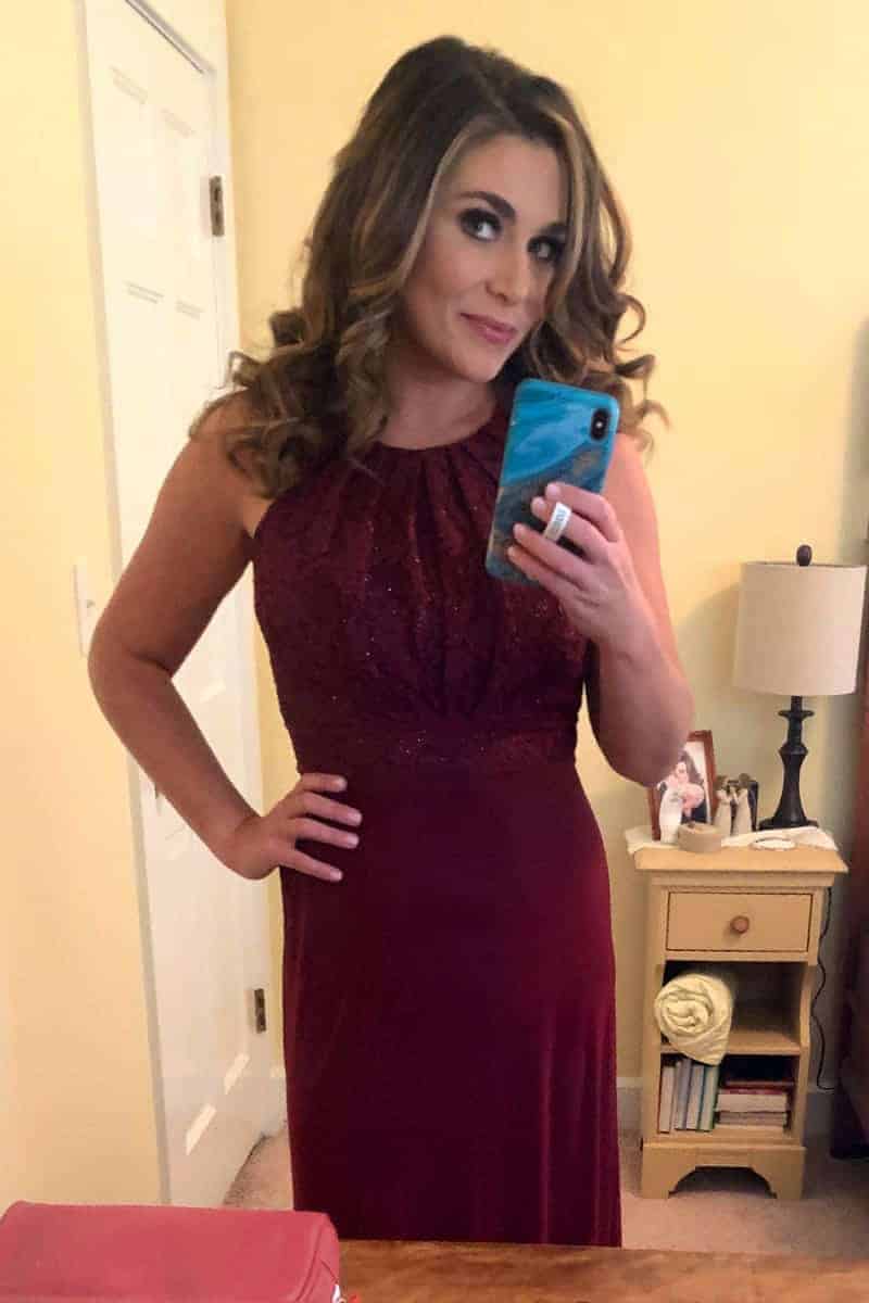 a woman in a red dress taking a selfie