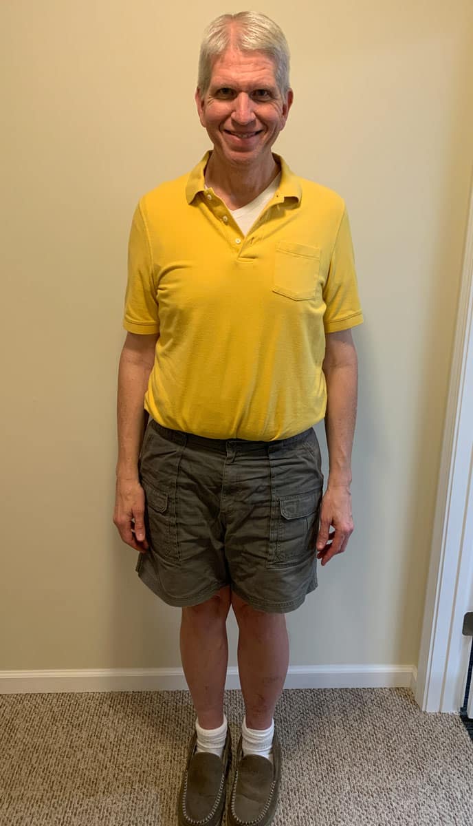 a man in a yellow shirt