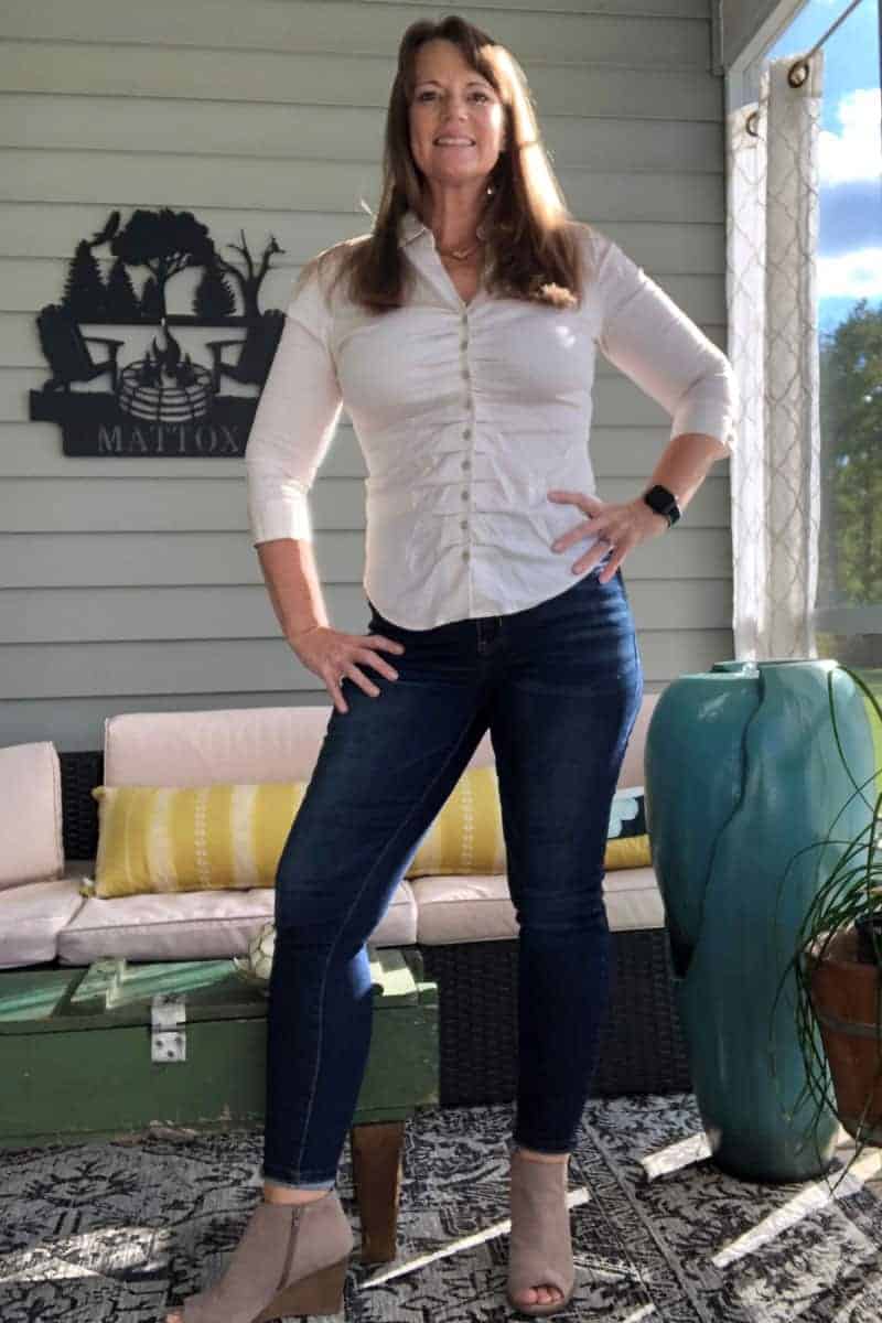 a woman standing in front of a porch