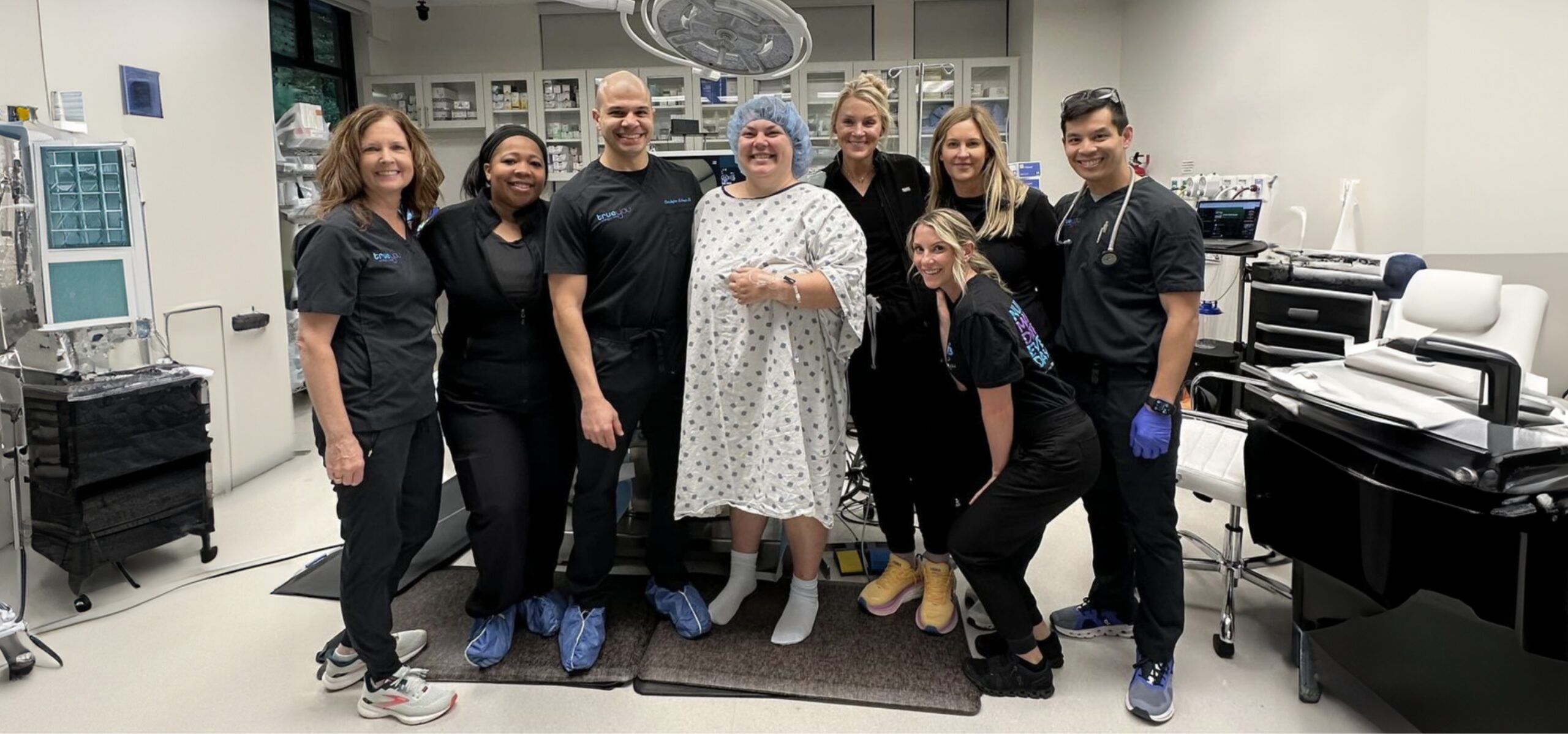 a group of people posing for a photo before procedure