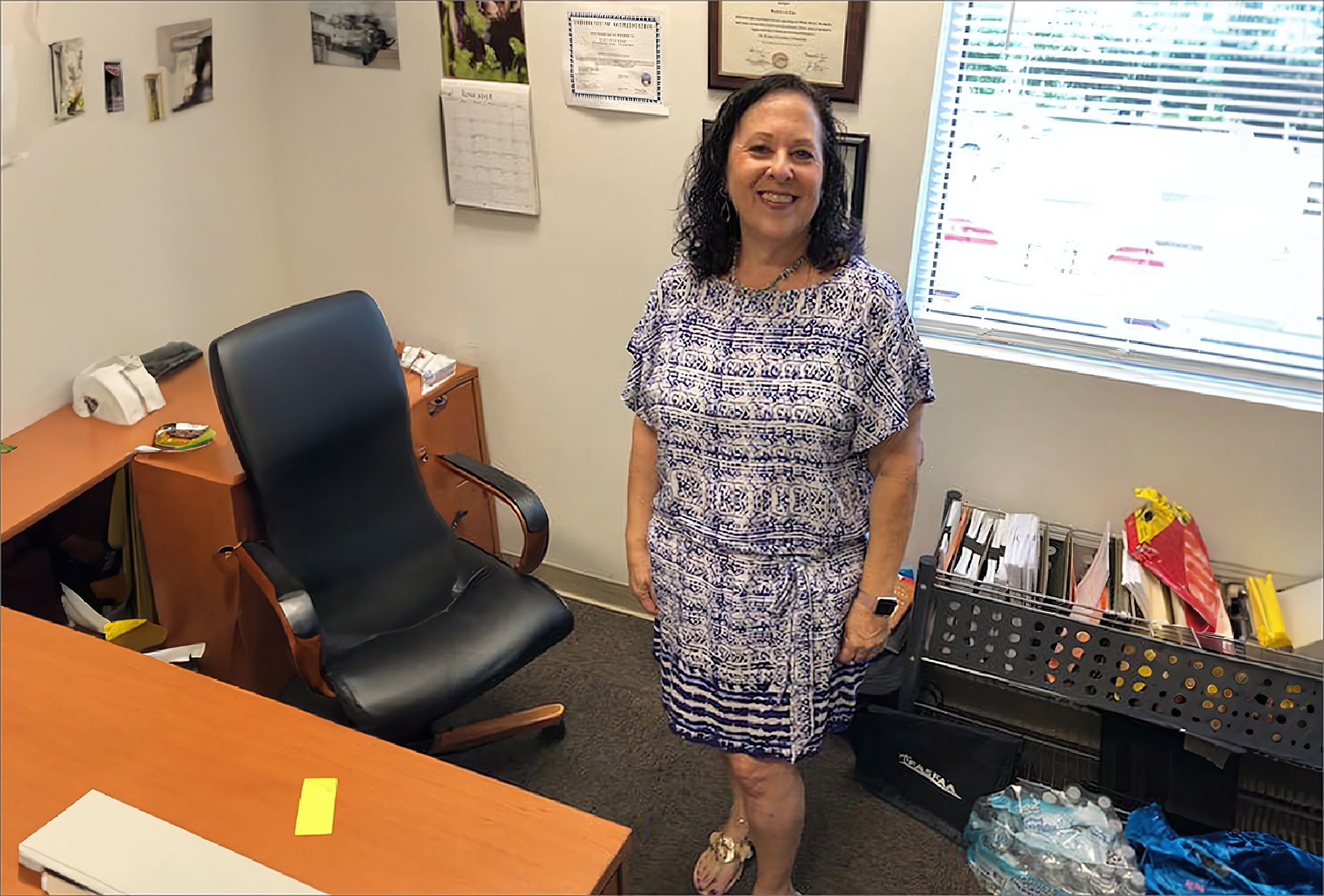 a woman standing in an office