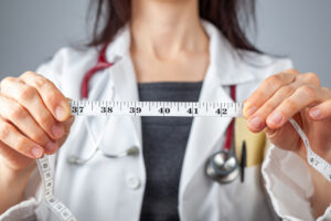 woman holding tape measurer