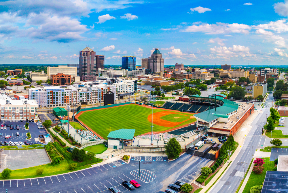 a baseball field and a city