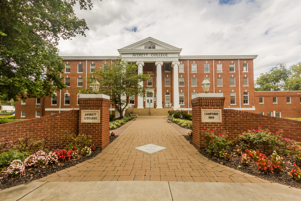 a brick walkway leading to a building